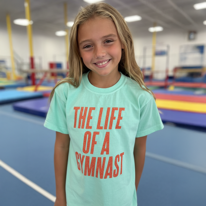 The Life of a Gymnast T-Shirt – Orange Glitter Print (Taylor-Inspired)